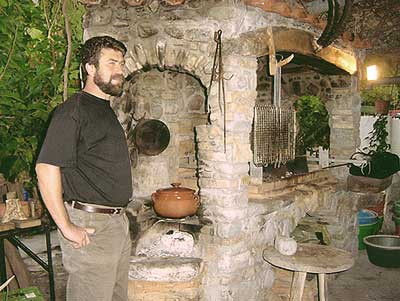 Roussos Viglis by the traditional open fire cooking place